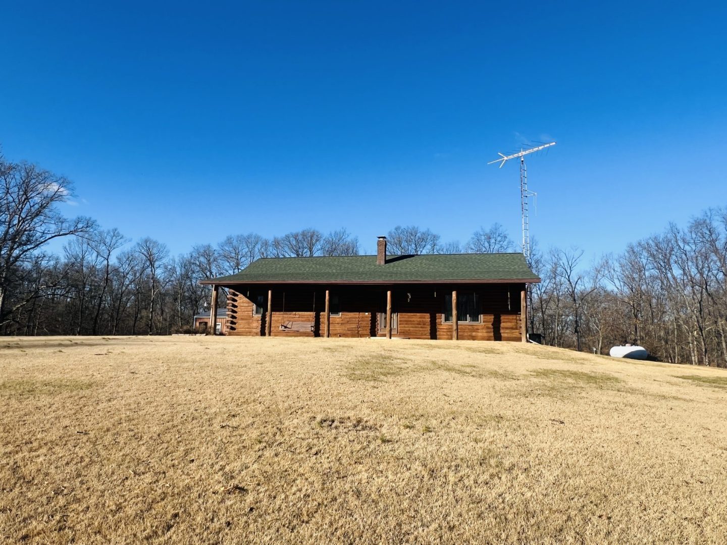 10 Acres with Log Home, Full Basement, Outbuilding and Pond